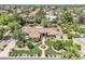 Expansive aerial view of a single-story home with a beautifully landscaped front yard and mature trees at 4222 E Brown Rd # 31, Mesa, AZ 85205