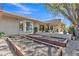 Spacious backyard featuring raised garden beds, gravel ground cover, and an outdoor living area at 4222 E Brown Rd # 31, Mesa, AZ 85205