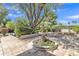 Tranquil backyard with a decorative fountain, mature trees, and a patio area perfect for relaxation at 4222 E Brown Rd # 31, Mesa, AZ 85205