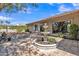 Charming backyard showcasing a decorative fountain, patio with brick pavers, and a well-maintained exterior at 4222 E Brown Rd # 31, Mesa, AZ 85205