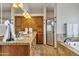 Bathroom featuring granite counters, double sinks, wood cabinets, tub and glass shower at 4222 E Brown Rd # 31, Mesa, AZ 85205