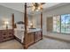Bedroom with four poster bed, side tables, lamps and shutters at 4222 E Brown Rd # 31, Mesa, AZ 85205