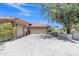 Three-car garage providing ample parking space, set against a backdrop of landscaped grounds at 4222 E Brown Rd # 31, Mesa, AZ 85205