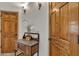Hallway with marble-topped table, wood doors, and decorative sconces at 4222 E Brown Rd # 31, Mesa, AZ 85205
