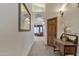 Hallway leading to the main bedroom with a decorative console table at 4222 E Brown Rd # 31, Mesa, AZ 85205