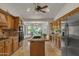 Well-appointed kitchen features a center island, granite counters, and stainless steel appliances at 4222 E Brown Rd # 31, Mesa, AZ 85205