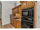 This kitchen features oak cabinets, granite countertops, and stainless-steel appliances at 4222 E Brown Rd # 31, Mesa, AZ 85205