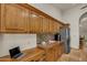 Gourmet kitchen with granite countertops and travertine floors featuring a stainless steel refrigerator at 4222 E Brown Rd # 31, Mesa, AZ 85205