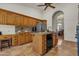 Kitchen with oak cabinets, stainless steel appliances, and stone countertops at 4222 E Brown Rd # 31, Mesa, AZ 85205