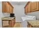 Convenient laundry room with granite counters, stainless steel sink, and plenty of storage space at 4222 E Brown Rd # 31, Mesa, AZ 85205