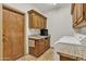 Updated laundry room with granite counters, stainless steel sink, and ample storage space at 4222 E Brown Rd # 31, Mesa, AZ 85205