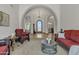 Bright open-concept living room with arched doorways, marble floors, and rustic furniture at 4222 E Brown Rd # 31, Mesa, AZ 85205