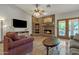 Inviting living room featuring a brick fireplace, tile flooring, and recessed lighting at 4222 E Brown Rd # 31, Mesa, AZ 85205