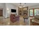 Inviting living room features a brick fireplace, tile flooring, and recessed lighting at 4222 E Brown Rd # 31, Mesa, AZ 85205