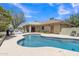 Beautiful pool with stone surround, ideal for relaxation and outdoor enjoyment in a serene backyard setting at 4222 E Brown Rd # 31, Mesa, AZ 85205