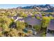 Aerial view of home with private pool and stunning mountain views at 11568 E Whispering Wind Dr, Scottsdale, AZ 85255