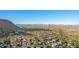 Expansive aerial view of homes with desert mountain views at 11568 E Whispering Wind Dr, Scottsdale, AZ 85255
