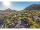 Community overview showcasing upscale homes, mountain views, and lush landscaping at 11568 E Whispering Wind Dr, Scottsdale, AZ 85255