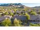 Aerial view of residential area, featuring homes and mountain scenery at 11568 E Whispering Wind Dr, Scottsdale, AZ 85255