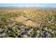 Aerial view of community near a rocky mountainside at 11568 E Whispering Wind Dr, Scottsdale, AZ 85255