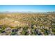 Aerial view of a luxury community nestled in a scenic desert landscape at 11568 E Whispering Wind Dr, Scottsdale, AZ 85255