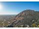 Aerial view of luxury homes against a mountain backdrop at 11568 E Whispering Wind Dr, Scottsdale, AZ 85255