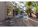 Landscaped backyard with pool and patio at 11568 E Whispering Wind Dr, Scottsdale, AZ 85255