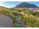 Backyard with pool, fire pit, and mountain views at 11568 E Whispering Wind Dr, Scottsdale, AZ 85255