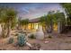 Desert landscaping with a private pool and patio at 11568 E Whispering Wind Dr, Scottsdale, AZ 85255
