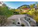 Backyard oasis with fire pit and mountain views at 11568 E Whispering Wind Dr, Scottsdale, AZ 85255