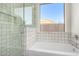 Updated bathroom with walk-in shower and a large window at 11568 E Whispering Wind Dr, Scottsdale, AZ 85255