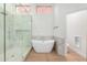 Elegant bathroom featuring a freestanding soaking tub and walk-in shower at 11568 E Whispering Wind Dr, Scottsdale, AZ 85255
