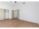 Bright bedroom with wood-look floors and double closets at 11568 E Whispering Wind Dr, Scottsdale, AZ 85255