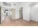 Bright bedroom with wood flooring and access to other rooms at 11568 E Whispering Wind Dr, Scottsdale, AZ 85255