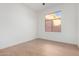 Light and airy bedroom with a ceiling fan and large window at 11568 E Whispering Wind Dr, Scottsdale, AZ 85255