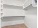 Bright, spacious closet with ample shelving and hanging rods at 11568 E Whispering Wind Dr, Scottsdale, AZ 85255