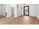 Bright and airy entryway with light wood flooring and neutral walls at 11568 E Whispering Wind Dr, Scottsdale, AZ 85255