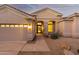 Home exterior showcasing a welcoming entryway and two-car garage at 11568 E Whispering Wind Dr, Scottsdale, AZ 85255