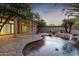 Stunning home exterior with beautiful landscaping and pool at 11568 E Whispering Wind Dr, Scottsdale, AZ 85255