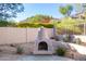 Outdoor fire pit with desert landscaping at 11568 E Whispering Wind Dr, Scottsdale, AZ 85255