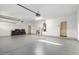 Spacious garage with overhead storage at 11568 E Whispering Wind Dr, Scottsdale, AZ 85255