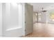 Bright hallway with light walls and wood floors at 11568 E Whispering Wind Dr, Scottsdale, AZ 85255