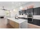Spacious kitchen featuring stainless steel appliances and hardwood floors at 11568 E Whispering Wind Dr, Scottsdale, AZ 85255