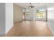 Light and airy living room with large windows and hardwood floors at 11568 E Whispering Wind Dr, Scottsdale, AZ 85255