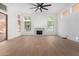 Bright living room with fireplace and hardwood floors at 11568 E Whispering Wind Dr, Scottsdale, AZ 85255