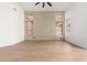 Spacious living room with large windows and hardwood floors at 11568 E Whispering Wind Dr, Scottsdale, AZ 85255