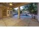 Covered patio overlooking the pool and backyard at 11568 E Whispering Wind Dr, Scottsdale, AZ 85255