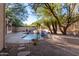 Private pool and waterfall feature in backyard at 11568 E Whispering Wind Dr, Scottsdale, AZ 85255