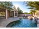 Private pool with waterfall feature at 11568 E Whispering Wind Dr, Scottsdale, AZ 85255