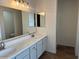 Bright bathroom with double sinks, long vanity and tile floors at 3922 N Creosote Ct, Casa Grande, AZ 85122